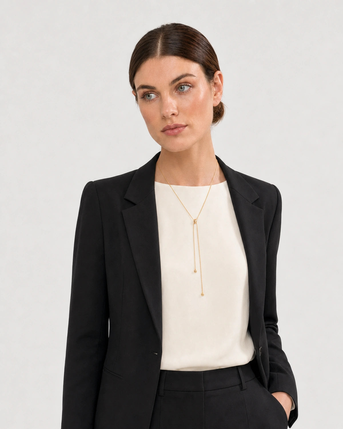 Alternate portrait of the same Australian model wearing the Vela slider lariat