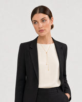 Alternate portrait of the same Australian model wearing the Vela slider lariat