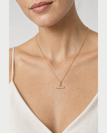 Clean neckline close-up showing the scale of the Vienne T-bar necklace