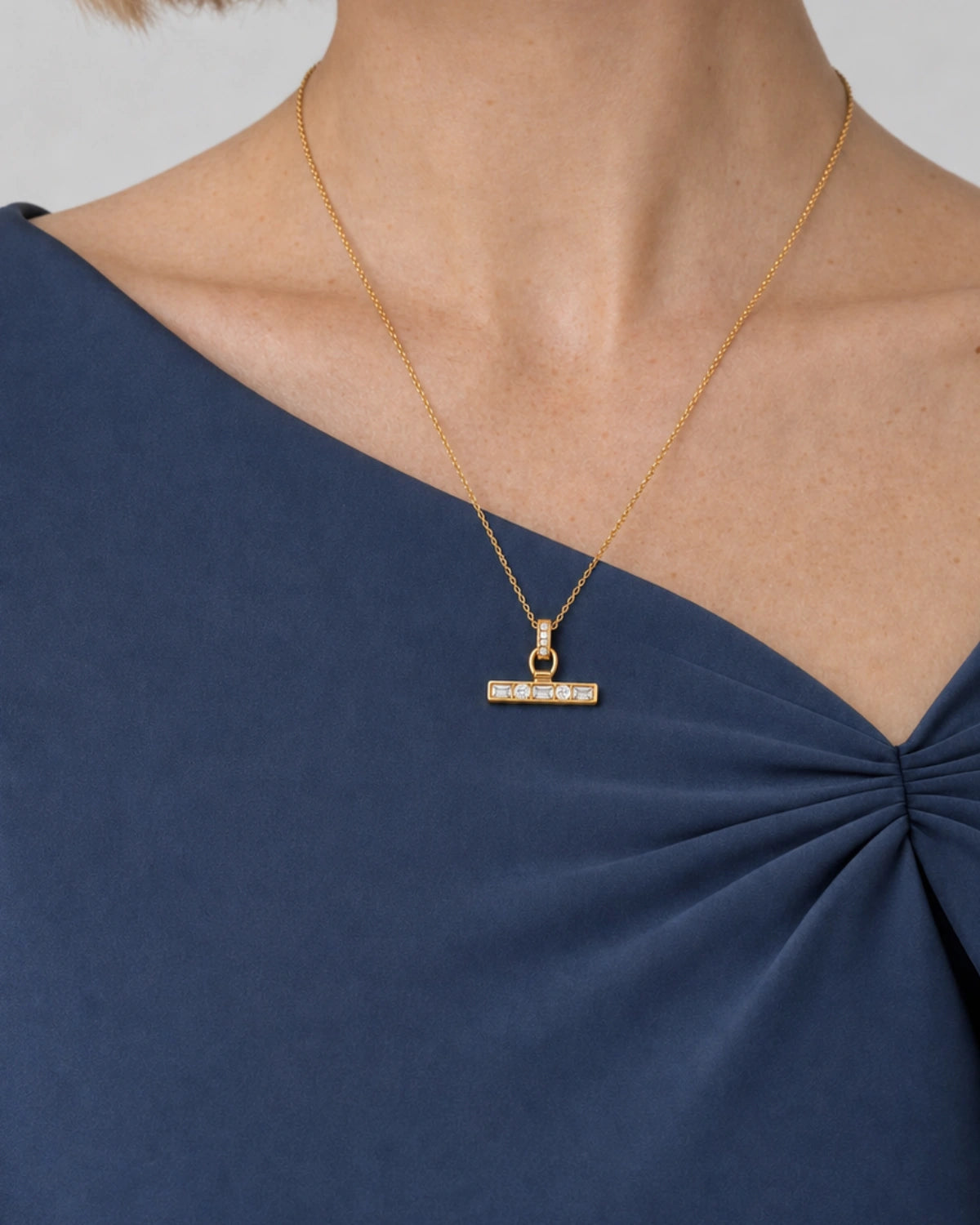 Eye-free three-quarter portrait of Margot wearing the Vienne necklace