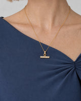 Eye-free three-quarter portrait of Margot wearing the Vienne necklace