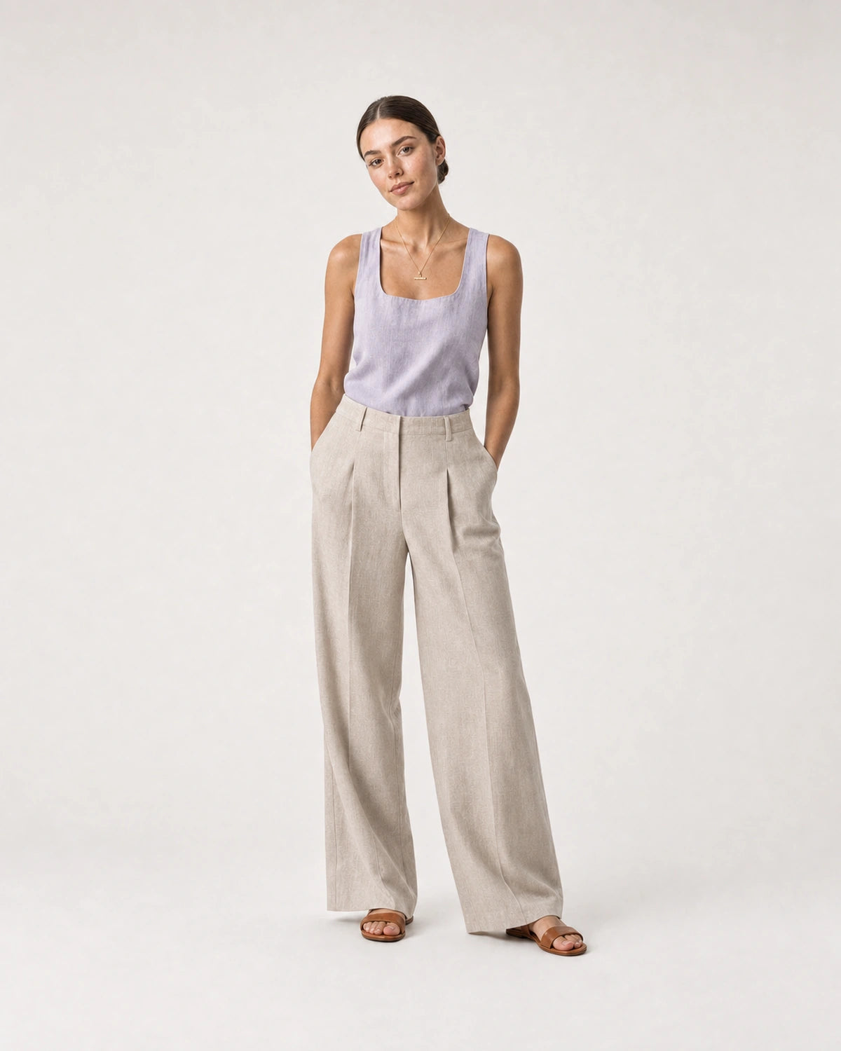 Full-body lilac and sand linen portrait featuring the Vienne necklace
