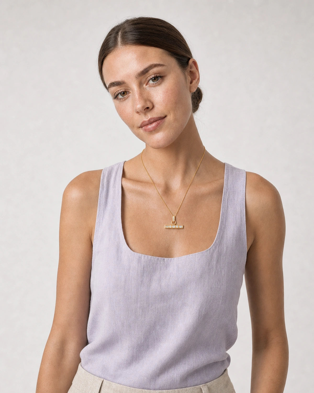 Human-scale summer portrait showing the Vienne crystal T-bar necklace