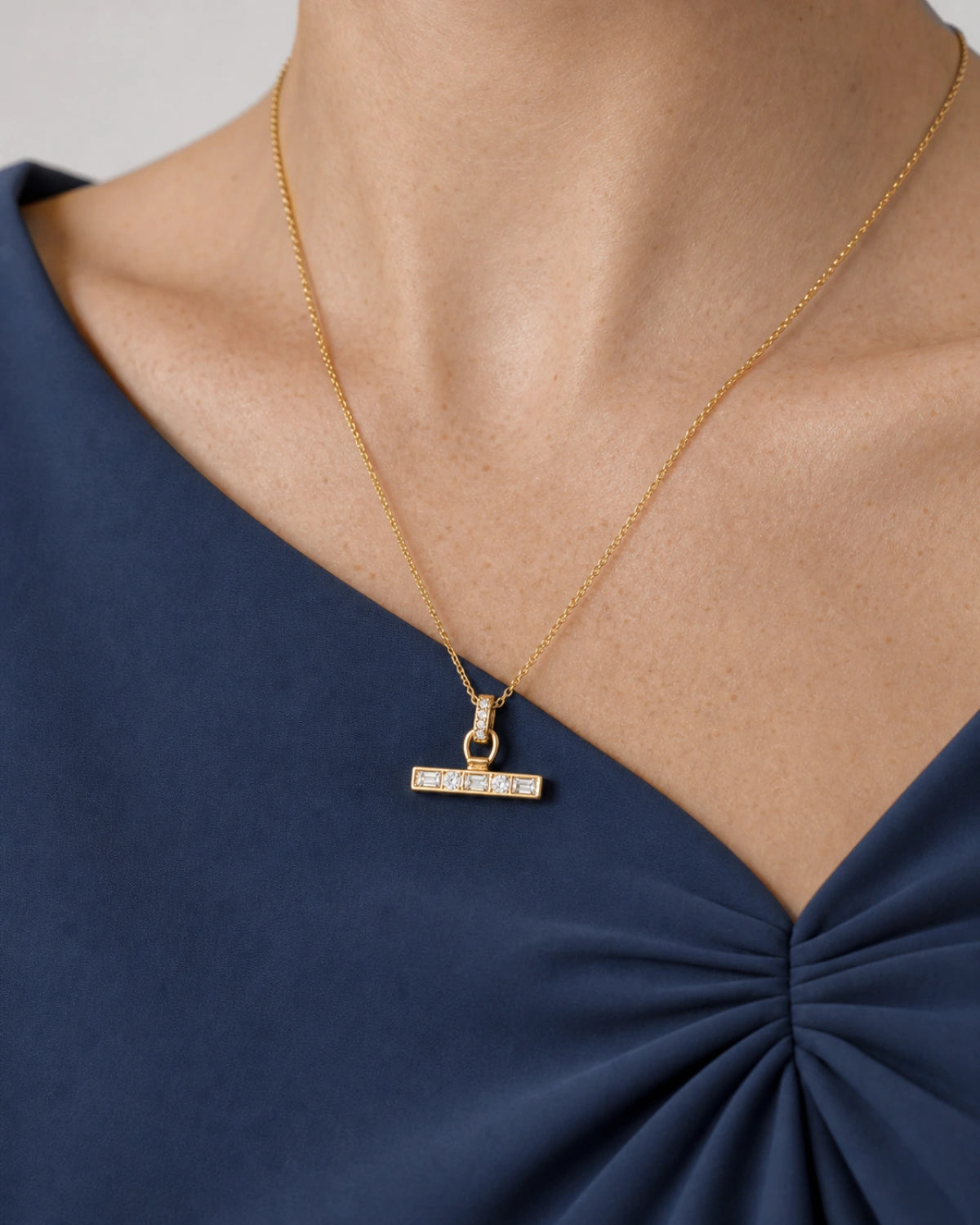 Complete worn macro of Margot wearing the Vienne crystal T-bar necklace