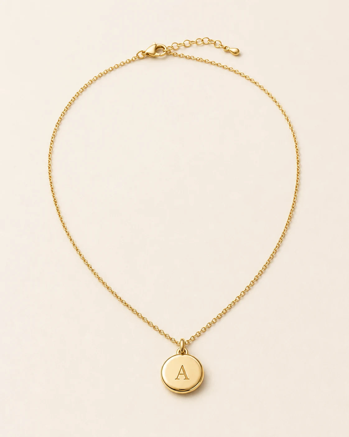 Amara Initial Medallion Necklace engraved with an A